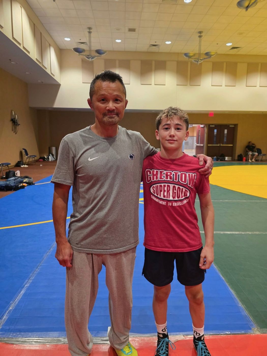 Sanshiro Abe and Korbin Kiessling standing together at Ken Chertow's summer wrestling camp