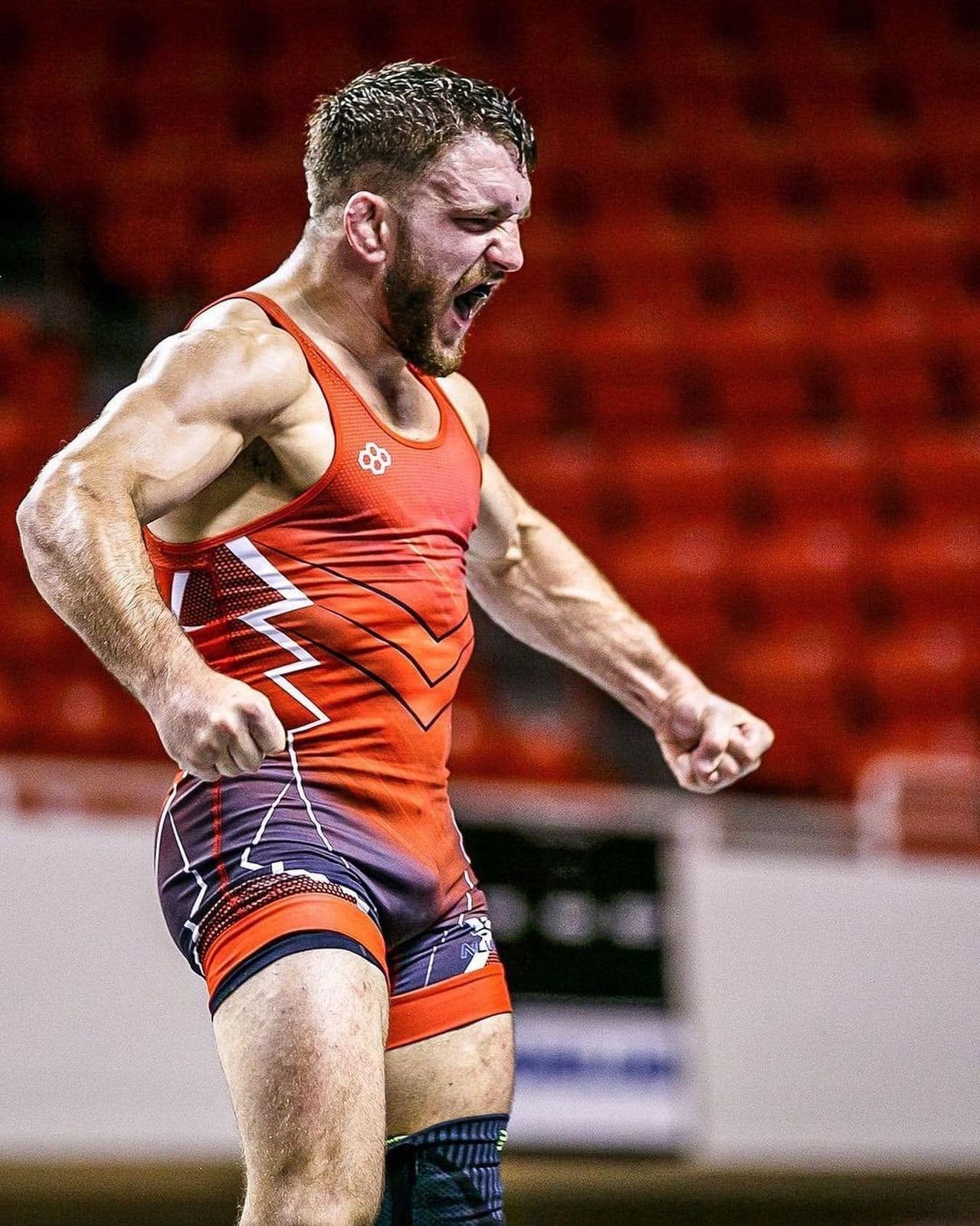 Zain Retherford celebrating a win in a Team USA singlet