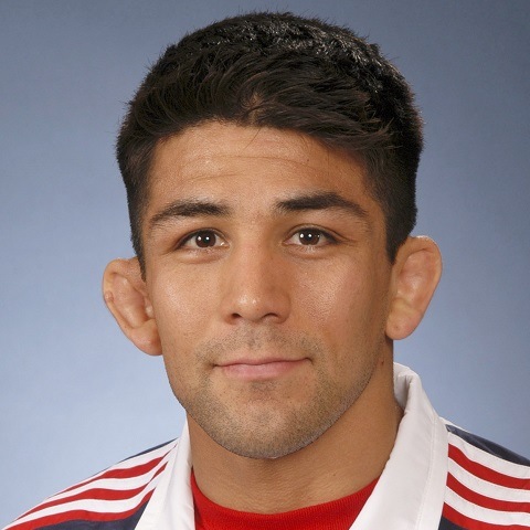 Eric Guerrero in a USA team warm-up jacket, on the coaching staff at Ken Chertow Gold Medal Training Camp