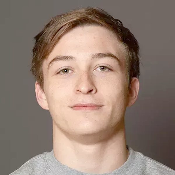 Nic Allison headshot in a grey Kutztown sweatshirt, on the staff at Ken Chertow's summer wrestling camp