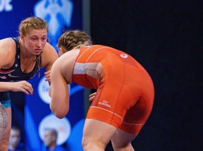 Kylie Welker in a USA singlet locked up with an opponent in a match