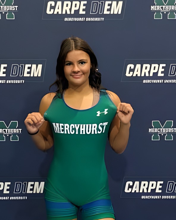Gigi Bragg in a green Mercyhurst singlet