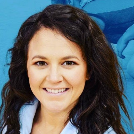 Nicole Woody smiling, a headshot
