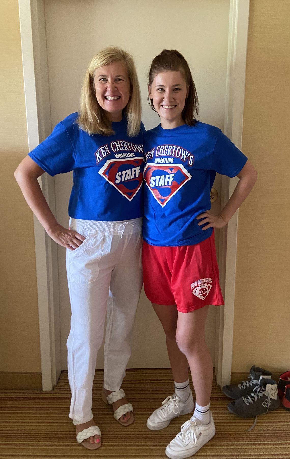 Beth Chertow and her daughter in blue Ken Chertow's Staff shirts at SuperGirl girls wrestling summer camp